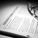 'glasses sitting on top of a document about power of attorney'
