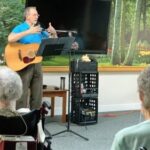 'Roy Justice singing for a group of homeland residents'