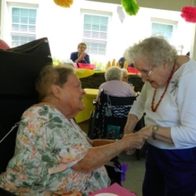 Homeland Center residents start the summer with music and strawberry shortcake