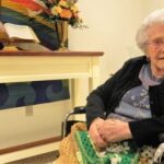 'Mary Yanich smiling in her wheelchair'