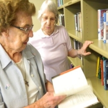 Homeland volunteers keep its popular Ted Lick Room library up to date