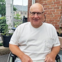 Resident Carl Barna grows a community garden