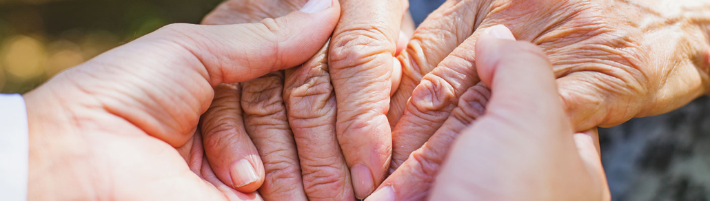 compassionate hand holding