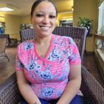 'Anna Hicks, medication technician, smiling in Homeland Center'