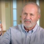 'bob green holding up his invention'