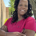 'Chastity (Chaz) Anderson Spencer, Homeland CNA, smiling next to a tree'