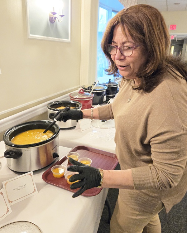 Activities Coordinator Diomaris Pumarol cooking for the souper bowl cookoff