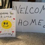 'handmade sign and card saying welcome home'