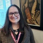 'Manager of Strategy and IT Jennifer Ross next to art'