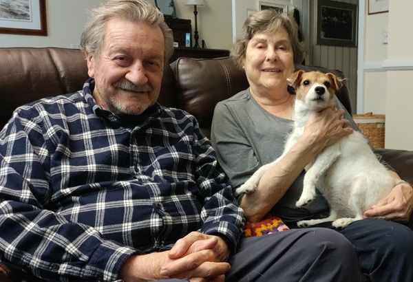 Homeland Residents Sue and Steve Valoczki smiling with their dog