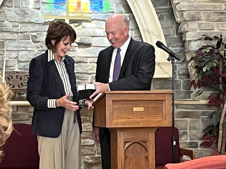 achievement being recognized at the annual board meeting