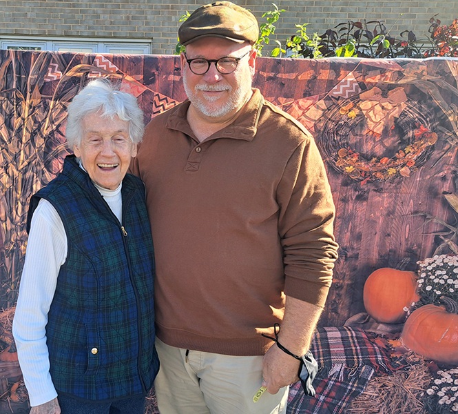 residents smiling together at the homeland fall fest