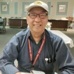 'Homeland Chef Manager George Shum smiling in a dining room'