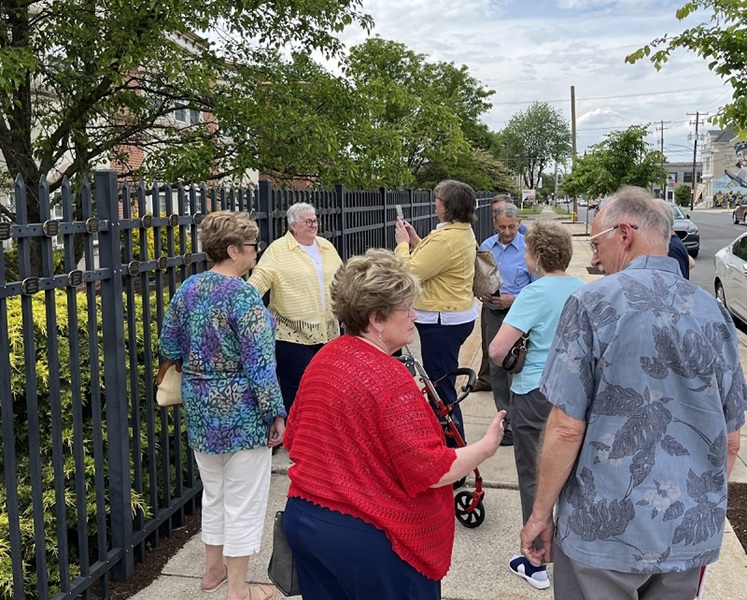 a group of visitors at the tribute medallion unveiling