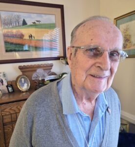 resident robert zimmerman smiling inside his residence