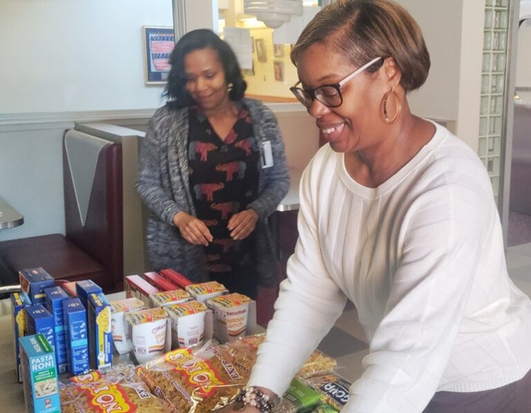 employees organizing the staff pantry cleanse event