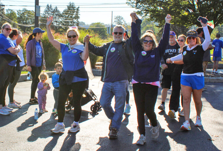 group of celebrating participants at the 2025 5k and memorywalk