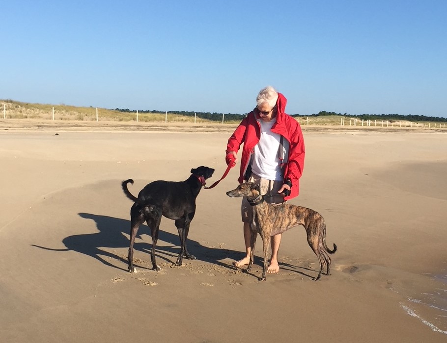 Charles Fetterhoff playing with his dogs