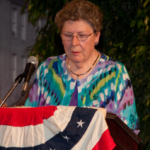 'Jackie Young at a podium'