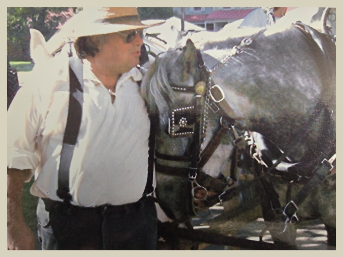 joe pulaski at a past farm show with a draft horse