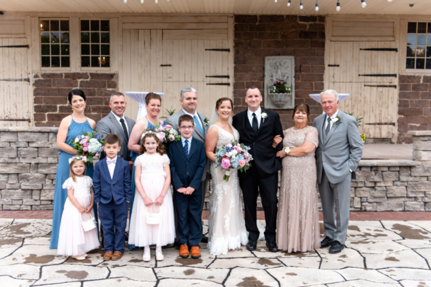 group photo from a wedding, including Dennis Dinger and Tina Jones