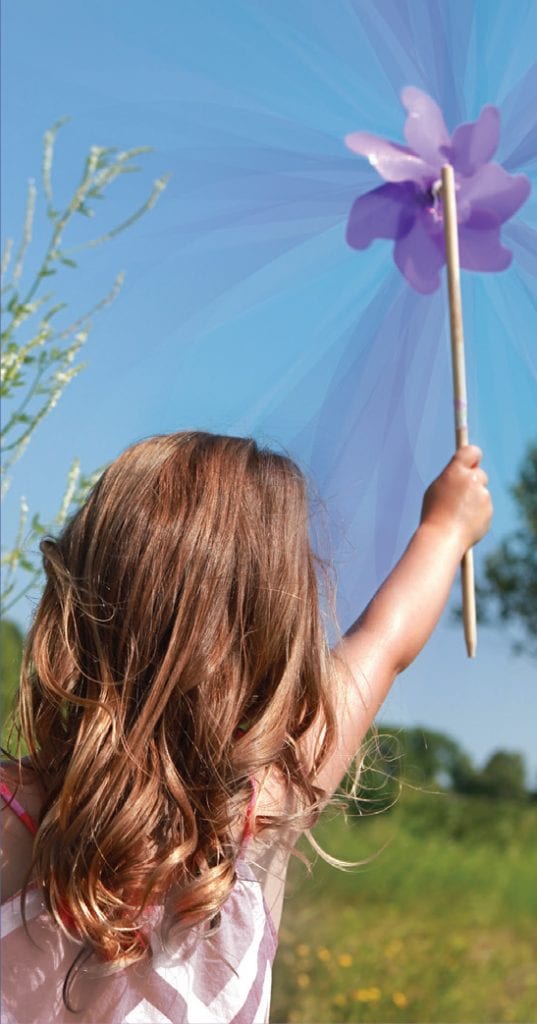 girl holding purple pinwheel
