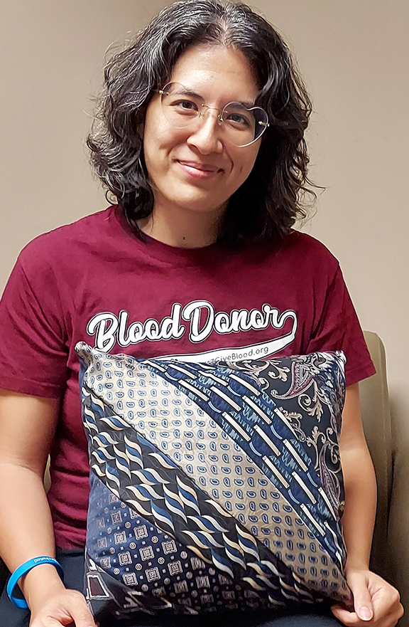 amy zecha with a pillow she sewed