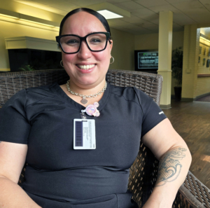 Transportation CNA Antonia Gomez smiling in an armchair
