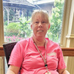 'housekeeper Christine McClucas relaxing inside of homeland center'
