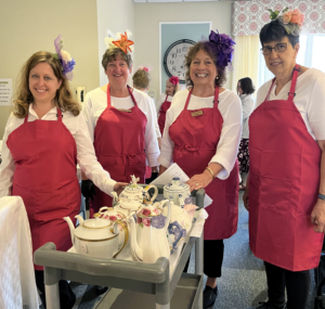 homeland staff gathered together for spring tea