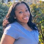 'registered nurse Symira Waters smiling outside'